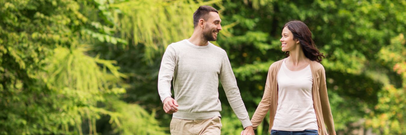  A couple walking hand in hand at a park during summer season enjoying life after rehab in Toms River